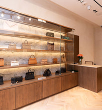 Load image into Gallery viewer, Bespoke oak shelving installation for Sellier Knightsbridge luxury boutique in London