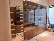 Load image into Gallery viewer, Bespoke oak shelving installation for Sellier Knightsbridge luxury boutique in London