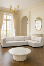 Load image into Gallery viewer, Luxury bespoke Amcross corner sofa with timber plinth in a modern London living room