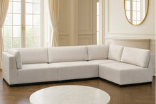 Load image into Gallery viewer, Luxury bespoke Amcross corner sofa with timber plinth in a modern London living room
