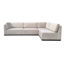 Load image into Gallery viewer, Luxury bespoke Amcross corner sofa with timber plinth in a modern London living room
