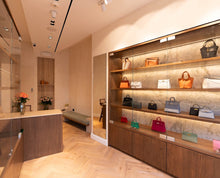 Load image into Gallery viewer, Bespoke oak shelving installation for Sellier Knightsbridge luxury boutique in London
