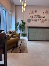 Load image into Gallery viewer, Luxury marketing suite in Hendon featuring bespoke seating and custom-made furniture
